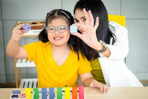 Caregiver playing with child