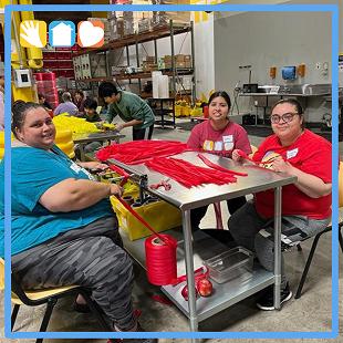 people at table doing arts and crafts