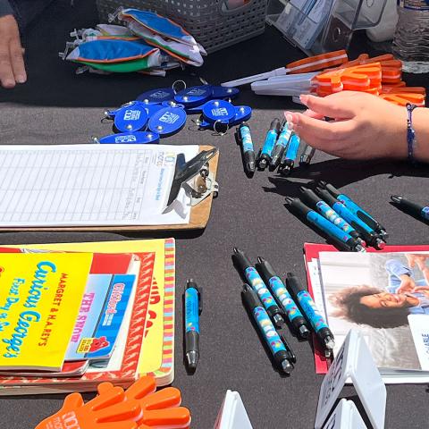 Table with pens and pads of papers