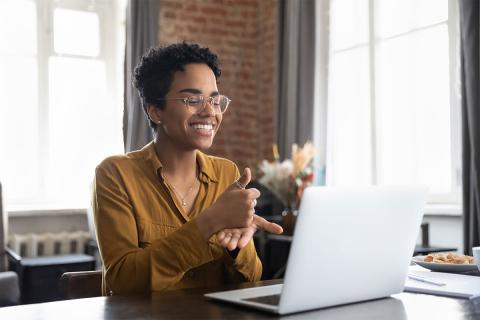 Woman at desk with laptop